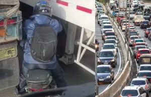 Motociclista se arriesga peligrosamente en medio de trancón en la Calle 13